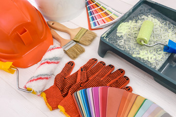 Top view at painting tools on wooden table