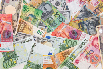 Obraz na płótnie Canvas Colorful banknotes of different countries as background close up