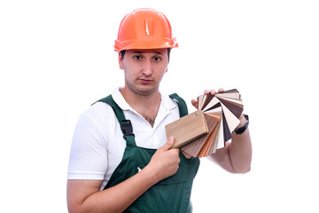 Carpenter in helmet with wooden sampler isolated on white