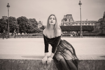 Holidays in Paris, France. Fashionable pretty woman rest in centre of city, concept of vacation. Lady in romantic look at street 