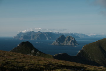 islands with a mountains and clear blue sky. a view from vaeroy island. Lofoten Islands