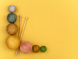 Set of yarn balls and needles.