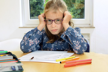 Little girl does not feel like doing homework or studying for school