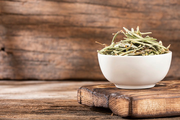 Rosmarinus officinalis - organic dry rosemary. Text space