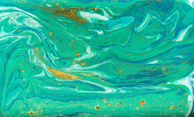 Blue, green and gold marbling pattern. Golden powder marble liquid texture.