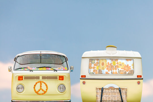 Vintage hipster yellow camper and caravan