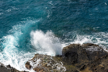 Waves crashing on rocky beach, beach, Batanes Philippines.