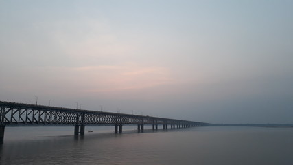 Fototapeta na wymiar Asia's longest rail and road bridge across the Godavari river in rajahmundry, India in evening