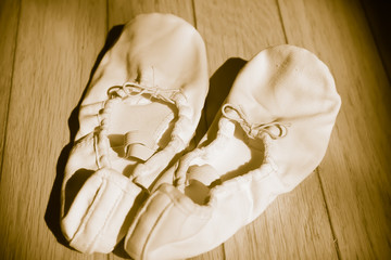 Closeup of a pair of dance shoes, ballet pointe shoes, and character shoes representing of dance classes in one image.  - Image