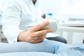 Fototapeta premium Young woman having 4D ultrasound scan. Ultrasound imaging,examination of the abdomen