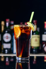 classic cocktail cuba libre with ice and close-up in a cuban bar
