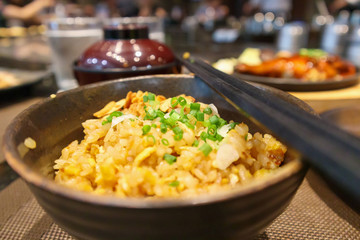 stir fried garlic rice with chopsticks close up