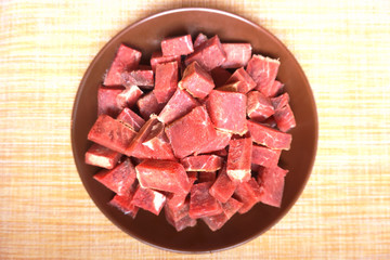 raw beef meat sliced into pieces