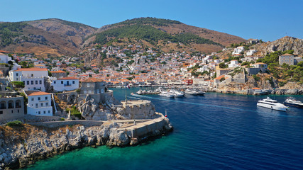 Fototapeta na wymiar Aerial drone panoramic photo of picturesque port and main village of Hydra or Ydra island with beautiful neoclassic houses, Saronic gulf, Greece