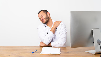 Doctor Colombian man suffering from pain in shoulder for having made an effort