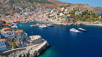 Aerial drone panoramic photo of picturesque port and main village of Hydra or Ydra island with beautiful neoclassic houses, Saronic gulf, Greece