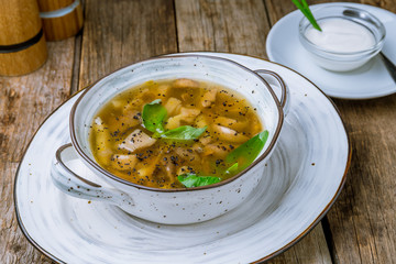 soup mushroom soup in a plate on wooden table