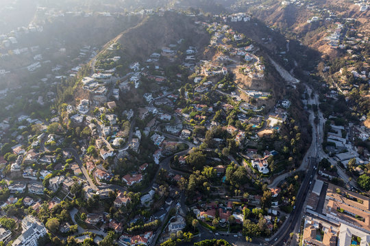 Aerial view of steep hillside homes near Laurel Canyon Blvd in the hills above West Hollywood and Los Angeles, California.