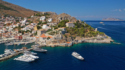 Fototapeta na wymiar Aerial drone panoramic photo of picturesque port and main village of Hydra or Ydra island with beautiful neoclassic houses, Saronic gulf, Greece