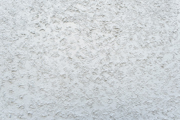 texture of the paint is white. Wall background with plaster .