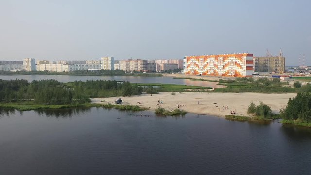 Nadym, RUSSIA - JULY 22, 2019: Citizens resting on the shore of taiga lake on the outskirts of the city
