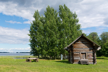 Obraz premium The Island Of Kizhi. Wooden cart and wooden house on the island.
