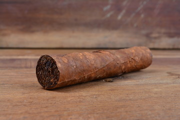 Cigars on wooden background