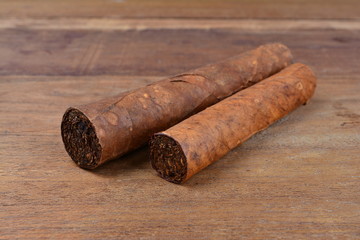 Cigars on wooden background