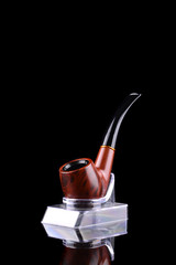 Obraz na płótnie Canvas Smoking pipe isolated on black background