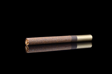 Cigar with reflection isolated on black background