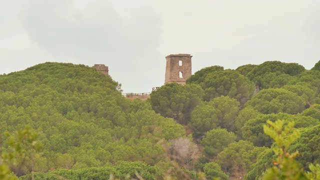 Ruins of old optical telegraph towers named Les Torretes near Calella - the semaphore towers were built in the mid-19th century. Catalonia, Spain.
