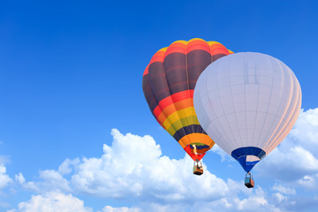 Colorful Hot Air Balloons in Flight over blue sky