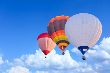 Obraz premium Colorful Hot Air Balloons in Flight over blue sky