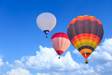 Colorful Hot Air Balloons in Flight over blue sky