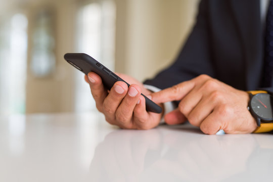 Close up of business man hands using smarpthone