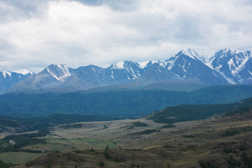 Summer in Kurai steppe and North-Chui ridge of Altai mountains, Russia. Cloud day.