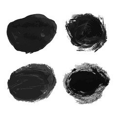 Set of four black hand drawn ink stains