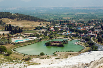Fototapeta premium white calcium mountain with granite with small waterfall in summer in Pamukkale