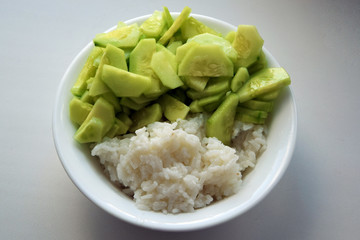 salad with cucumbers and rice closeup