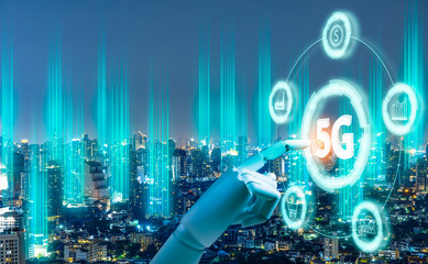5G network digital hologram and internet of things on city background.Robot android hand holding icon 5g.5G network wireless systems,IoT(Internet of Things),communication network concept.