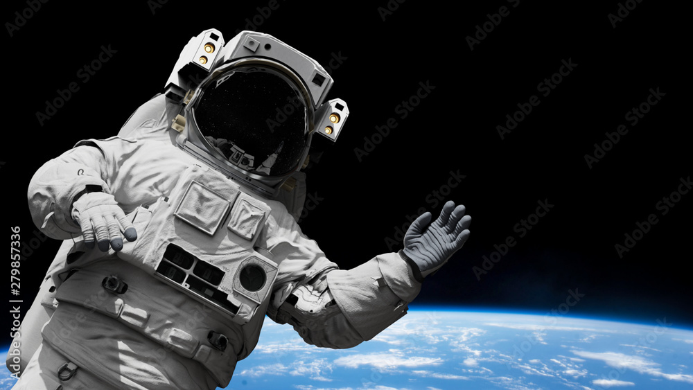 Wall mural astronaut waving during a spacewalk in orbit of planet earth