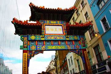 The colorful arch of entry to Chinatown in London, in the typical picturesque neighborhood