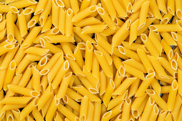 Detail of pasta penne with eggs. Ready for cooking.