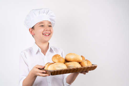 Cook Boy With Bread On White Background.