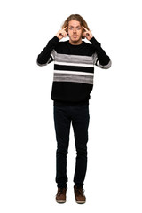 Fototapeta premium Full-length shot of Blonde man having doubts and thinking over isolated white background