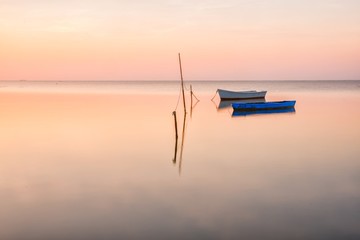 Boats at sunrise in Delta de Ebro Natural Park