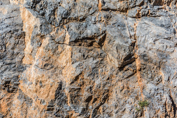 background and texture of mountain layers and cracks in sedimentary rock on cliff face. Cliff of rock mountain.