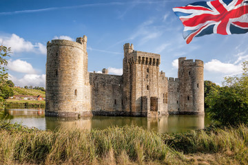 Historic Bodiam Castle with flag of England in East Sussex, United Kingdom