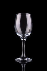 Empty wine glass isolated on black