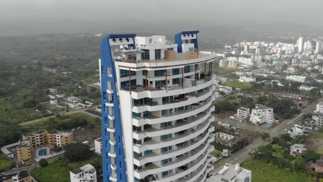 Aerial view of a large building on a small town at Tonsupa Beach